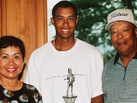 Tiger Woods with his parents Kultida and Earl Woods.