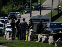 LEXINGTON, KENTUCKY - JULY 13: Police assess the scene after a shooting at Richmond Road Baptist Church on July 13, 2025 in Lexington, Kentucky. Two people were killed and two others injured at the church after the shooter shot and injured a state trooper at the Blue Grass Airport before fleeing and eventually stopping at the Richmond Road Baptist Church. (Photo by Michael Swensen/Getty Images)