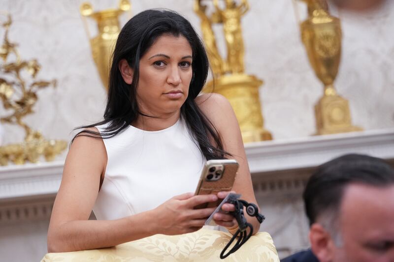 WASHINGTON, DC - MAY 30: White House Deputy Chief of Staff Stephen Miller's wife, Katie Miller, listens as U.S. President Donald Trump and Tesla CEO Elon Musk speak to reporters in the Oval Office of the White House on May 30, 2025 in Washington, DC. Musk, who served as an adviser to Trump and led the Department of Government Efficiency, announced he would leave his role in the Trump administration to refocus on his businesses. (Photo by Kevin Dietsch/Getty Images)