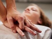 Teacher giving first aid training