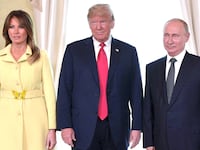 US President Donald Trump (C), Russia's President Vladimir Putin and US First Lady Melania Trump