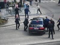Security officers move Slovakia Prime Minister Robert Fico in a car after a shooting incident, after a Slovak government meeting in Handlova, Slovakia, May 15, 2024.