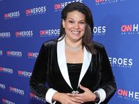 Sara Sidner smiles on a red carpet outside the CNN Heroes tribute.