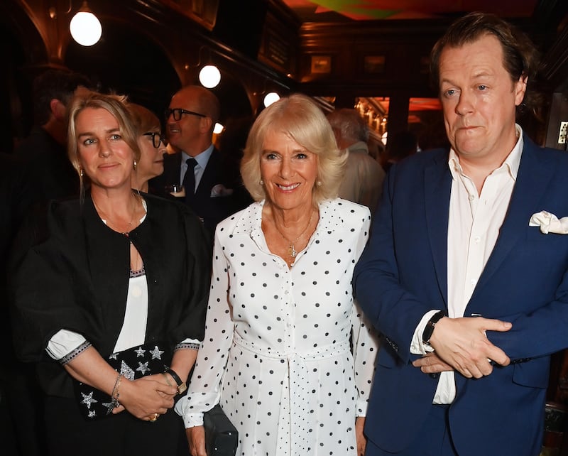 Laura Lopes (née Parker Bowles), Queen Camilla, and Tom Parker Bowles attend the launch of Tom's new book, "Cooking & The Crown," at The Audley Public House on September 05, 2024, in London, England.