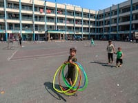A view from inside the UN school with Palestinians seeking refuge after Israeli airstrikes destroyed homes and buildings in Gaza