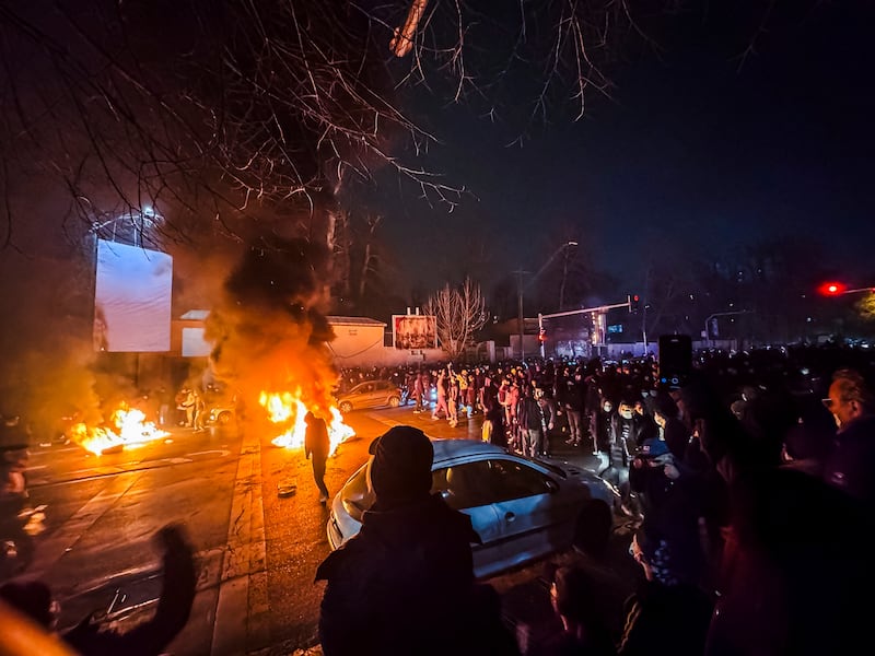 Iranians gather while blocking a street during a protest in Tehran, Iran on January 9, 2026. The nationwide protests started in Tehran's Grand Bazaar against the failing economic policies in late December.