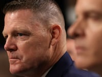 Ronald Rowe Jr. stares forward during a congressional hearing.