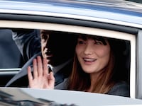 articles/2013/03/21/carla-bruni-sarkozy-might-model-for-bulgari-bar-rafaeli-at-arms-with-the-idf/carla_bruni_in_car_fashion_cs_xo4jfq