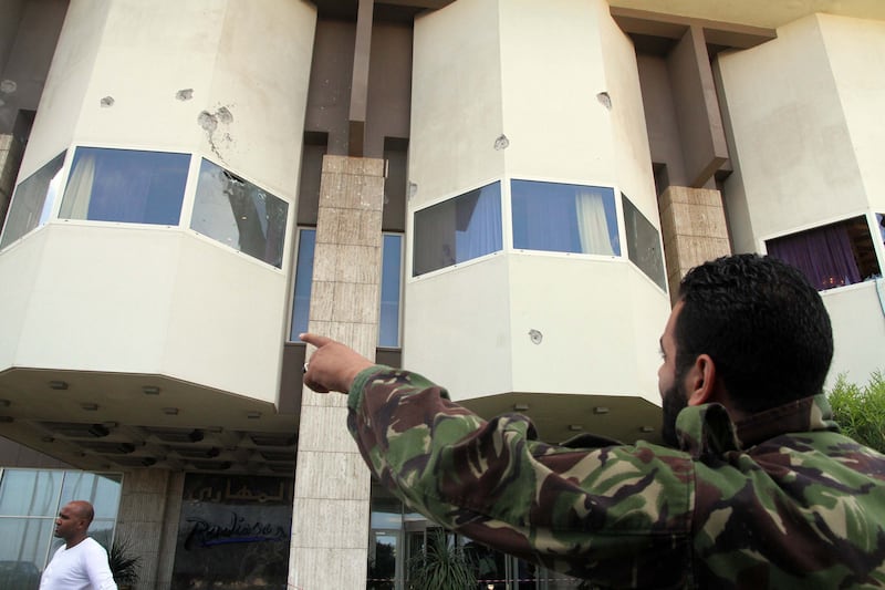 articles/2013/11/08/libya-on-the-brink-as-militia-fighting-engulfs-tripoli/131107-dettmer-libya-tease_qkcpec
