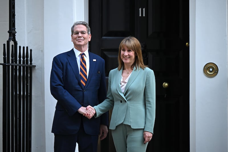 Rachel Reeves (R), greets Scott Bessent, outside 11, Downing Street on September 16, 2025 in London, England.