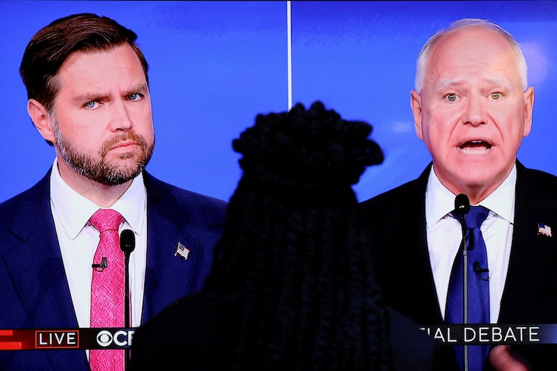 A screen shows Republican vice presidential nominee U.S. Senator JD Vance (R-OH) and Democratic vice presidential nominee Minnesota Governor Tim Walz attending a debate hosted by CBS in New York,