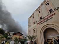 "moke rises following an Israeli strike near the Indonesian Hospital that ran out of fuel and electricity, in the northern Gaza Strip, November 12, 2023.