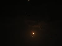 Missiles are seen in the skies of Gaza City following the attack from Iran, in Gaza on April 14, 2024.