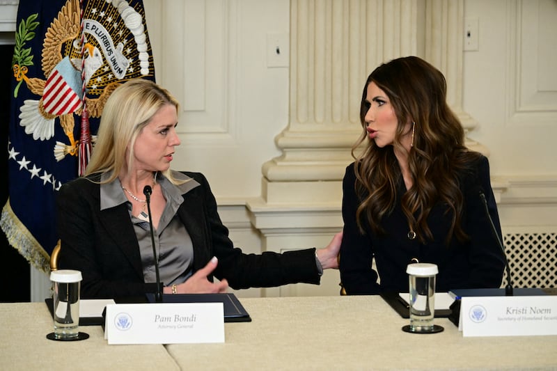 US Attorney General Pam Bondi (L) speaks with Homeland Security Secretary Kristi Noem