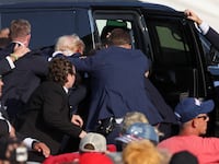 Republican presidential candidate and former U.S. President Donald Trump gets into a vehicle with the assistance of U.S. Secret Service personnel after assassination attempt