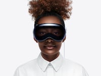 Apple Vision Pro headset on a woman.