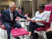 King Charles meets with patients during a visit to the University College Hospital Macmillan Cancer Centre in London, April 30, 2024.