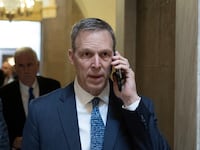 Rep. Scott Perry (R-PA) uses a cellphone while walking to the House Chamber on Capitol Hill in Washington, D.C., Feb. 2, 2023.