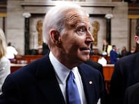 Joe Biden walks among the crowd of congressman after his State of the Union speech.