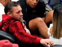 Irish mixed martial artist Conor McGregor looks on during the first half in game four of the 2023 NBA Finals between the Miami Heat and the Denver Nuggets at Kaseya Center.
