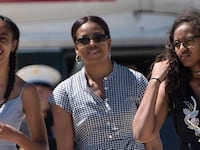 President Barack Obama, daughter Malia Obama, US first lady Michelle Obama, and daughter Sasha Obama walk to Air Force One