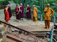 Buddhist monks stand at the site of a cable car accident in Sri Lanka's north-western district of Kurunegala on September 25, 2025. Seven Buddhist monks, including three foreigners, were killed when their cable-pulled rail car snapped and crashed down a mountainside in north-western Sri Lanka, police said on September 25.