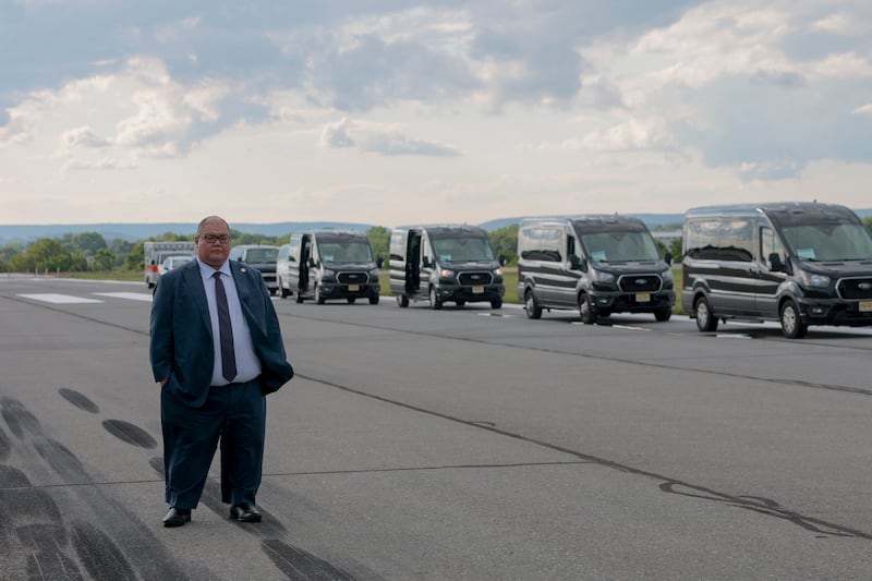 White House Communications Director Steven Cheung looks on as U.S. President Donald Trump walks off Air Force One at the Lehigh Valley International Airport on August 01, 2025 in Allentown, Pennsylvania.