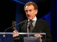Arnold Diaz winning an Emmy in 2011.