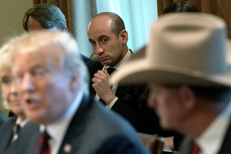 WASHINGTON, DC - JANUARY 11: U.S. President Donald Trump speaks as Senior Advisor to the President Stephen Miller (C) listens during a round-table discussion on border security and safe communities with State, local, and community leaders in the Cabinet Room of the White House on January 11, 2019 in Washington, DC. As the second-longest government shut down continues, Democrats and Republicans have not found a compromise for border security funding and President Donald Trump's proposed wall on the U.S.-Mexico border. (Photo by Alex Wong/Getty Images)