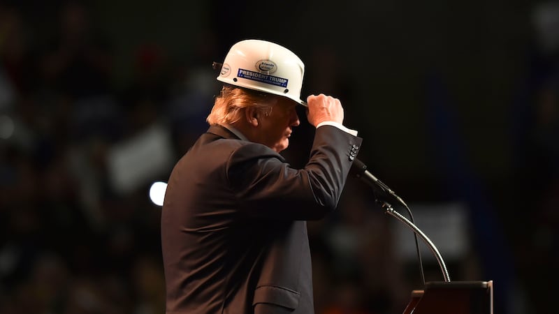 Trump wearing a hard hat.