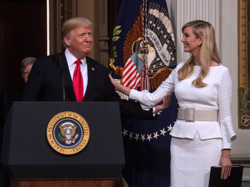 US President Donald Trump thanks his daughter Ivanka before addressing the Interagency Task Force to Monitor and Combat Trafficking in Persons annual meeting at the White House in Washington, DC, on October 11, 2018. (Photo by NICHOLAS KAMM / AFP) (Photo credit should read NICHOLAS KAMM/AFP via Getty Images)