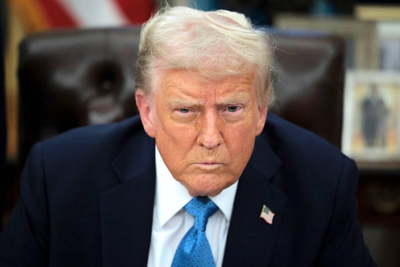 Donald Trump talks to reporters after signing an executive order, "Unleashing prosperity through deregulation," in the Oval Office on January 31, 2025 in Washington, D.C.