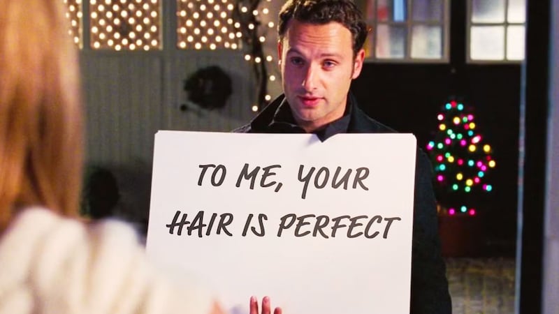 Andrew Lincoln in Love Actually (2003) with his sign reading, "to me, your hair is perfect"