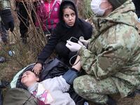 2021-11-11T171506Z_53302887_RC2GSQ9SIQ1R_RTRMADP_3_EUROPE-MIGRANTS-BELARUS-POLAND_wgalye