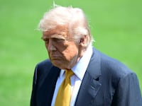 WASHINGTON, UNITED STATES - MAY 12: U.S. President Donald Trump speaks to members of the press before boarding Marine One on the South Lawn of the White House in Washington, United States, on May 12, 2026. (Photo by Kyle Mazza/Anadolu via Getty Images)