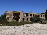 An abandoned ex-military command building on a hilltop on the island of Sazan, near the Albanian city of Vlore, on Mediterranean coast, on July 30 2024.
