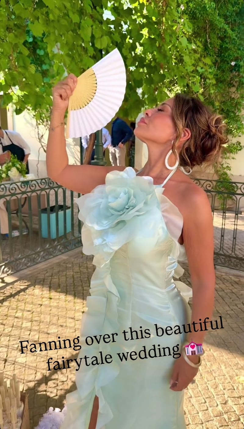 Some Redditors thought Dolores Catania’s wedding guest dress was “overpowering” and “bridal.”
