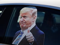 CARSON CITY, NV - OCTOBER 18: A photograph of President Donald Trump is seen on a car window before a campaign rally on October 18, 2020 in Carson City, Nevada. With 16 days to go before the November election, President Trump is back on the campaign trail with multiple daily events as he continues to campaign against Democratic presidential nominee Joe Biden. (Photo by Stephen Lam/Getty Images)