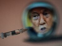 A syringe and a drop of medicine at the tip of a syringe with the portrait of former U.S. President Donald Trump.