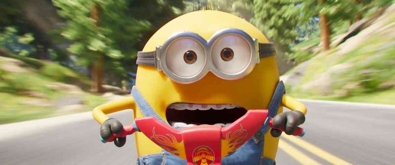 A yellow character with braces races on his bike.