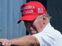 Former US President Donald Trump points at the crowd as he attends Round 3 of the LIV Golf-Bedminster