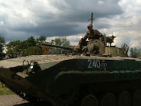 articles/2015/07/16/russian-troops-picnic-on-mh-17-wreckage/150716-nemtsova-mh-17-embed_femozt