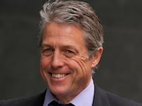 Hugh Grant walks outside the High Court, in London, Britain, April 27, 2023.
