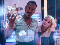 Ncuti Gatwa and Millie Gibson look at a large molecule in a still from ‘Doctor Who’