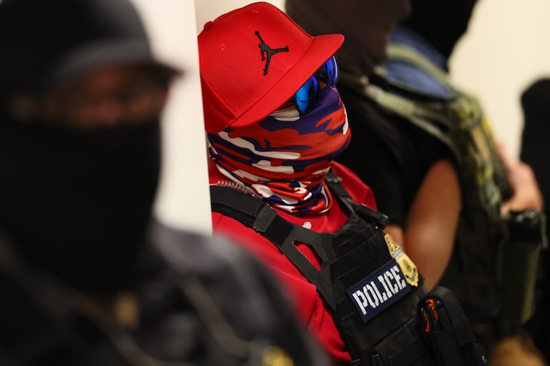 Federal agents wearing masks patrol the halls of immigration court at the Ted Weiss Federal Building on July 09, 2025 in New York City.