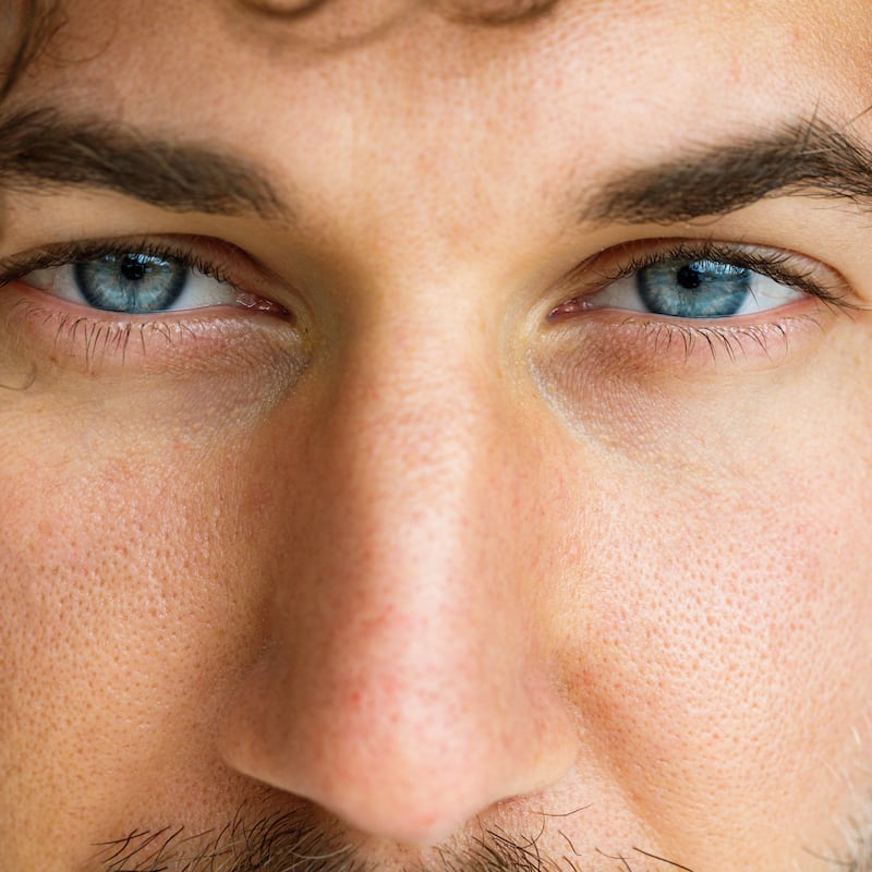 Close up of man's blue eyes looking at camera