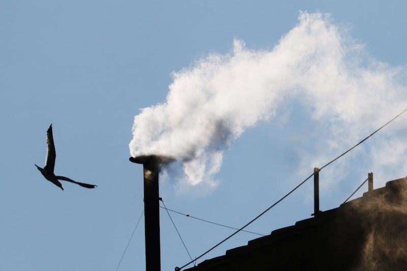 White smoke rises from the chimney on the Sistine Chapel, indicating that a new pope has been elected at the Vatican, May 8, 2025.