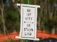 A sign is seen during a protest at the site of a proposed Atlanta police training center, derisively called "cop city."