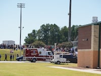 Students wait to be picked up by their parents after a shooting at Apalachee High School
