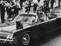 The Presidential motorcade with Texas governor John Connally, first lady Jackie Kennedy and President John F. Kennedy on November 21, 1963.